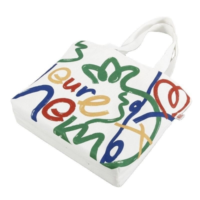 Sac de magasinage en toile de couleur personnalisé de grande capacité avec conception et logo du visage souriant