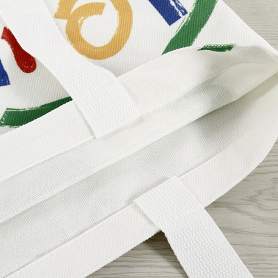 Sac de magasinage en toile de couleur personnalisé de grande capacité avec conception et logo du visage souriant